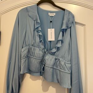 NWT. Size small. Lovers and friends, blue blouse